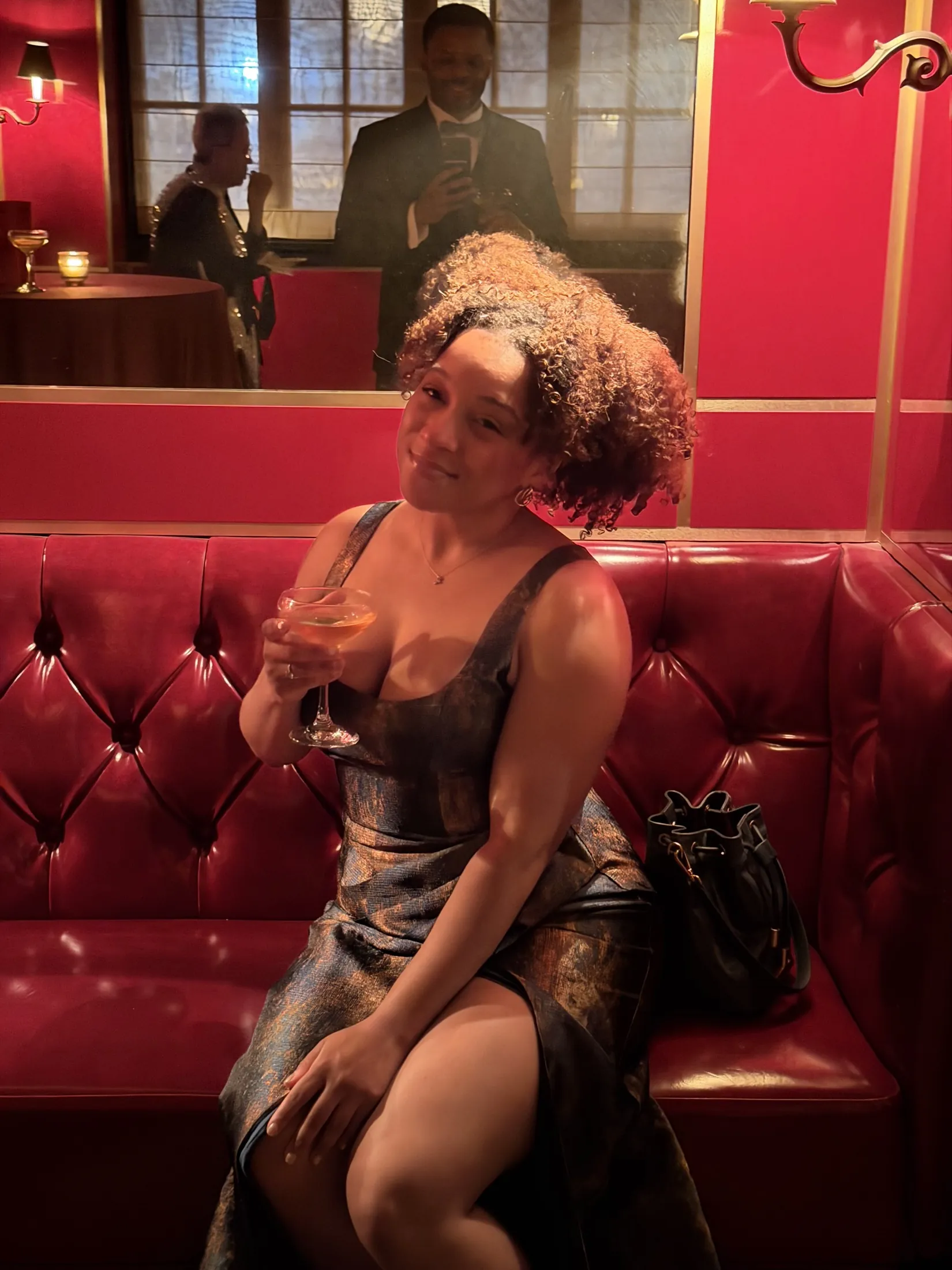 An evening portrait in a red lounge